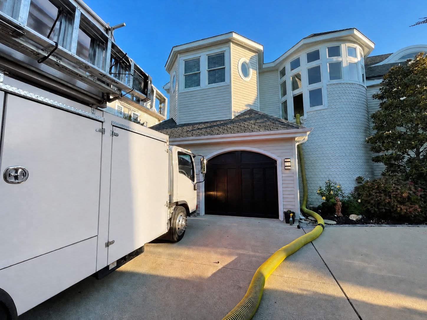 Duct cleaning equipment outside a residential home
